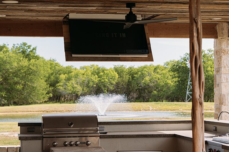 Outdoor audio-visual system on a covered patio